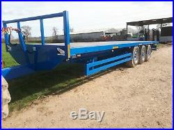 32ft tri axle bale trailer. Super singles Fits Tractor