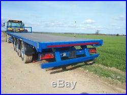 32ft tri axle bale trailer. Super singles Fits Tractor