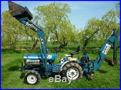 Ford 1210 compact mini tractor with loader and back hoe. 3 buckets plus mower/