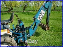 Ford 1210 compact mini tractor with loader and back hoe. 3 buckets plus mower/