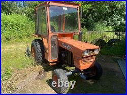 Kubota compact tractor and topper