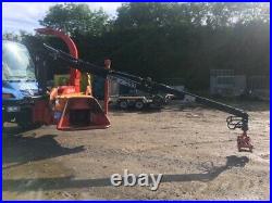 Unimog tractor mounted crane fed Ducker TP270 whole tree woodchipper bandit